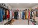 Spacious walk-in closet with ample shelving and hanging space for clothes and shoes at 5291 Meredrew Ln, St Cloud, FL 34771