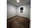 Cozy bedroom with a plush carpet, a window, and a closet, providing a comfortable and inviting space at 567 Viceroy Ct, Kissimmee, FL 34758