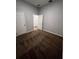 Bedroom featuring carpet, light gray walls, and doors to the hallway and other rooms at 567 Viceroy Ct, Kissimmee, FL 34758