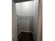 Walk-in closet featuring carpeted floor and wire shelving units for optimal storage and organization at 567 Viceroy Ct, Kissimmee, FL 34758