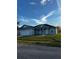 Charming single-story home with a two-car garage, manicured lawn, and covered entryway, set against a bright blue sky at 567 Viceroy Ct, Kissimmee, FL 34758