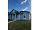 Single-story home featuring a covered entryway with columns, white-trimmed windows, and a well-maintained lawn at 567 Viceroy Ct, Kissimmee, FL 34758