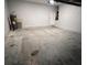 Spacious two-car garage featuring a concrete floor, utility access and a white door to the house at 567 Viceroy Ct, Kissimmee, FL 34758