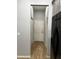 Hallway with wood-look flooring leading to the front door with a clear view to the entry at 567 Viceroy Ct, Kissimmee, FL 34758