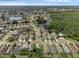 Aerial view showcasing the community, lakes, and lush green surroundings at 5729 Norman H Cutson Dr, Orlando, FL 32821