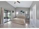 Bright bedroom with tile floors, a ceiling fan, a glass sliding door, and plenty of natural light at 5729 Norman H Cutson Dr, Orlando, FL 32821