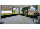 This tiled patio has an adjacent yard view and barbeque grill, perfect for relaxing and entertaining at 5729 Norman H Cutson Dr, Orlando, FL 32821