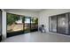 An outdoor patio features sliding glass doors to the yard and a gas grill for outdoor cooking at 5729 Norman H Cutson Dr, Orlando, FL 32821