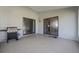 The spacious outdoor patio has sliding glass doors to the interior, and a barbeque grill for entertaining at 5729 Norman H Cutson Dr, Orlando, FL 32821
