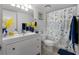 Clean bathroom with a modern vanity, bright lighting, and a decorative shower curtain at 658 Lake Villas Dr, Altamonte Springs, FL 32701