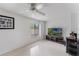 Contemporary room with light tile flooring, a ceiling fan, and a window for ample natural light at 658 Lake Villas Dr, Altamonte Springs, FL 32701