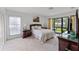 Cozy bedroom with a sliding glass door providing natural light and access to the outside at 658 Lake Villas Dr, Altamonte Springs, FL 32701