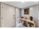 Bright entryway featuring a stylish console table, light-colored floors, and modern decor at 658 Lake Villas Dr, Altamonte Springs, FL 32701