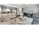 Bright living room with stylish tile floors, large rug, and open access to the dining room at 658 Lake Villas Dr, Altamonte Springs, FL 32701