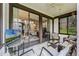 Covered patio with cozy seating, ceiling fan, and beautiful views of the yard at 658 Lake Villas Dr, Altamonte Springs, FL 32701
