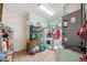 Functional laundry room featuring washer, dryer, shelving and storage at 7135 Sw 129Th St, Ocala, FL 34473