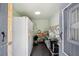 Storage room with a refrigerator, freezer and stainless-steel countertops at 7135 Sw 129Th St, Ocala, FL 34473