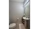 Bathroom with vanity, modern sink, and standard toilet with tiled floors at 7629 Ripplepointe Way, Windermere, FL 34786