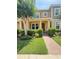 Charming townhouse with a brick pathway, well-maintained lawn, and inviting front porch at 7629 Ripplepointe Way, Windermere, FL 34786