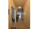 Bright hallway features tiled flooring, neutral walls, and leads to the living area at 7629 Ripplepointe Way, Windermere, FL 34786
