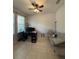 Versatile home office space with neutral walls, tiled floors, and natural light at 7629 Ripplepointe Way, Windermere, FL 34786