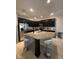 Spacious kitchen boasts granite countertops, a large island, and modern stainless-steel appliances at 7629 Ripplepointe Way, Windermere, FL 34786
