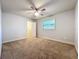 Bedroom featuring ceiling fan, window with blinds, and closet at 7679 Bent Bow Trl, Winter Park, FL 32792