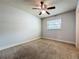Bright bedroom featuring ceiling fan and a window with blinds at 7679 Bent Bow Trl, Winter Park, FL 32792