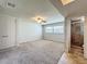 Bright bedroom with neutral carpet, ceiling fan and ensuite bathroom at 7679 Bent Bow Trl, Winter Park, FL 32792
