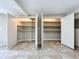 Open walk-in closet with adjustable shelving, providing ample storage space for an organized wardrobe at 7679 Bent Bow Trl, Winter Park, FL 32792