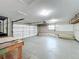 Clean garage with workbench, whiteboard, and plenty of storage space at 7679 Bent Bow Trl, Winter Park, FL 32792