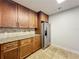 Stylish kitchen with stainless steel appliances and granite countertops at 7679 Bent Bow Trl, Winter Park, FL 32792