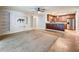 This living room features recessed shelving, a ceiling fan, and is open to the kitchen and bar at 7679 Bent Bow Trl, Winter Park, FL 32792