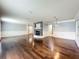 Living room offering hardwood floors, fireplace, and decorative trim at 7679 Bent Bow Trl, Winter Park, FL 32792