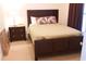 Comfortable bedroom with a queen-size bed, stylish nightstand, and neutral tones at 7842 Holiday Isle Dr # 102, Belle Isle, FL 32812