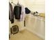 Closet with clothes hanging, a wire rack, and personal items at 7842 Holiday Isle Dr # 102, Belle Isle, FL 32812