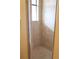 Walk-in shower features neutral tiling and glass door at 7842 Holiday Isle Dr # 102, Belle Isle, FL 32812