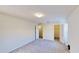 Large bedroom has neutral carpet, doors to a closet and bathroom, and a window for natural light at 8520 La Isla Dr, Kissimmee, FL 34747