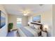 Tranquil bedroom featuring a large window, modern decor, and a comfortable bed with soft lighting at 8520 La Isla Dr, Kissimmee, FL 34747
