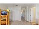 Carpeted bedroom with closet space and two doors leading to additional rooms at 8520 La Isla Dr, Kissimmee, FL 34747