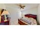 Cozy bedroom with ceiling fan, closet, and tiled floor providing a comfortable retreat at 8520 La Isla Dr, Kissimmee, FL 34747