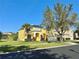 Charming two-story home with well-manicured lawn, solar panels, and inviting curb appeal at 8520 La Isla Dr, Kissimmee, FL 34747