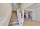 Inviting foyer featuring a staircase with natural light and tile flooring at 8520 La Isla Dr, Kissimmee, FL 34747