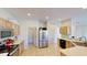 Well-equipped kitchen with tile flooring, stainless steel appliances, and ample counter space at 8520 La Isla Dr, Kissimmee, FL 34747