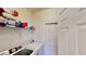 Convenient laundry room featuring a washer, dryer, and ample storage space at 8520 La Isla Dr, Kissimmee, FL 34747