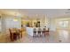 Bright living room features a breakfast bar, dining area, and tile flooring throughout at 8520 La Isla Dr, Kissimmee, FL 34747
