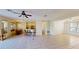 Open-concept floor plan features a breakfast bar, dining area, and tile flooring throughout at 8520 La Isla Dr, Kissimmee, FL 34747