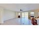 A spacious living room with sliding door access to the lanai and backyard at 8520 La Isla Dr, Kissimmee, FL 34747