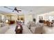 Spacious living room with a breakfast bar, dining area, and an open concept layout at 8520 La Isla Dr, Kissimmee, FL 34747
