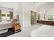 Modern bathroom adjacent to main bedroom with floating vanity and glass shower at 9743 Covent Garden Dr, Orlando, FL 32827